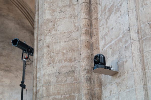 Security camera mounted on historical church stone wall